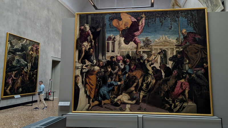 Accademia Galleries : Tintoretto's Saint Mark Rescuing the Slave (1548), originally painted for Scuola Grande di San Marco, depicts the evangelist swooping into the scene mid-flight and shattering the instruments of torture to save a devoted slave from martyrdom