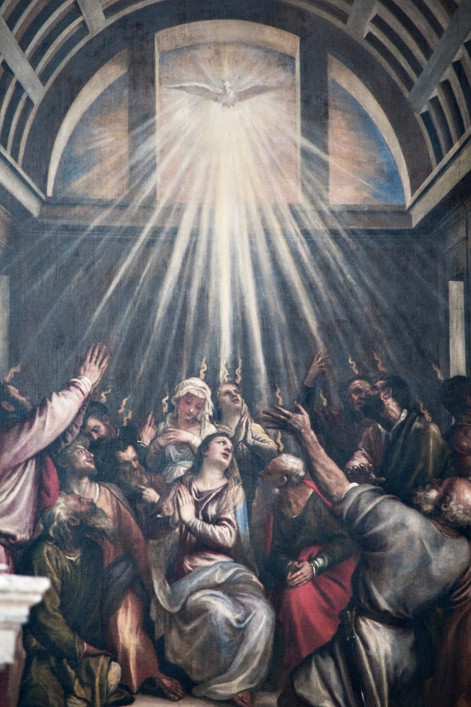La Salute : The dove, symbolizing the Holy Spirit, casts light onto the apostles below as tongues of fire appear above their heads, marking the Spirit’s arrival