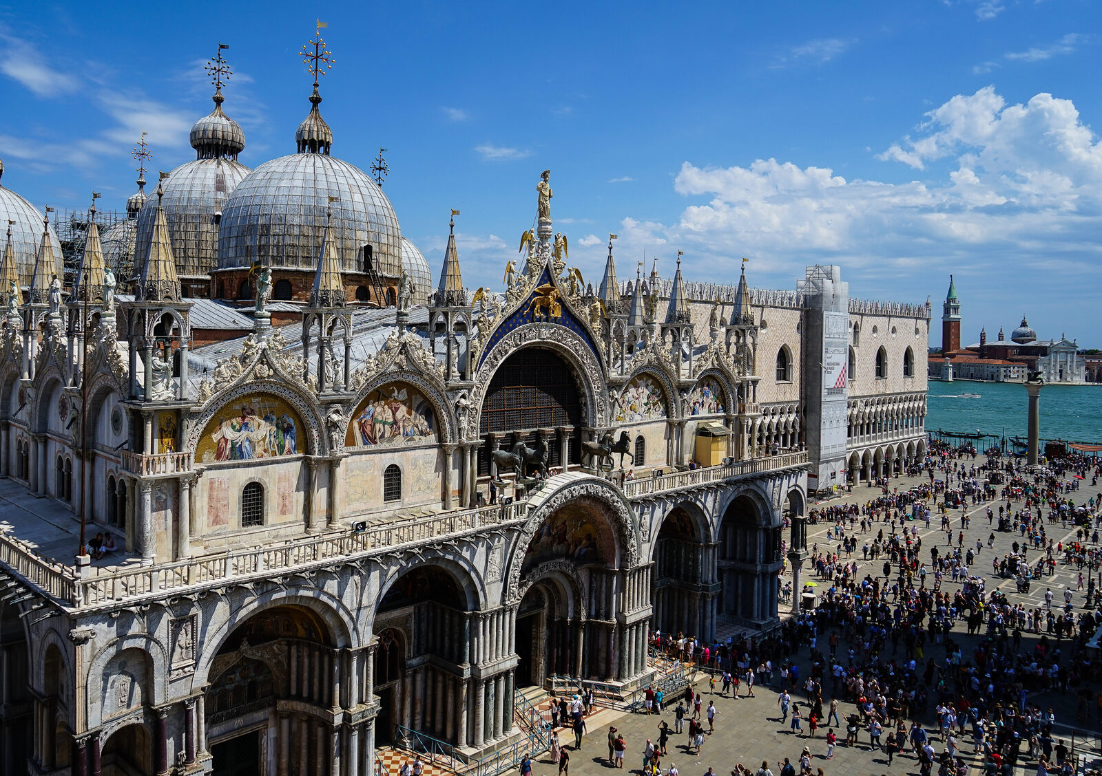 Basilica di San Marco : The western facade, with the adjacent Palazzo Ducale and the lagoon in the background, as seen from Torre dell'Orologio