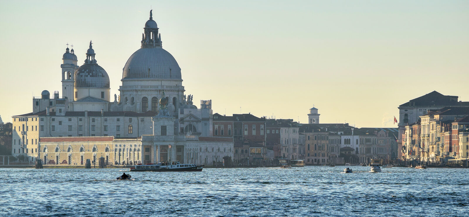 Canal Grande : Let's begin our sunset cruise from the end of the canal connecting to the lagoon and sail upstream, passing by Punta della Dogana
