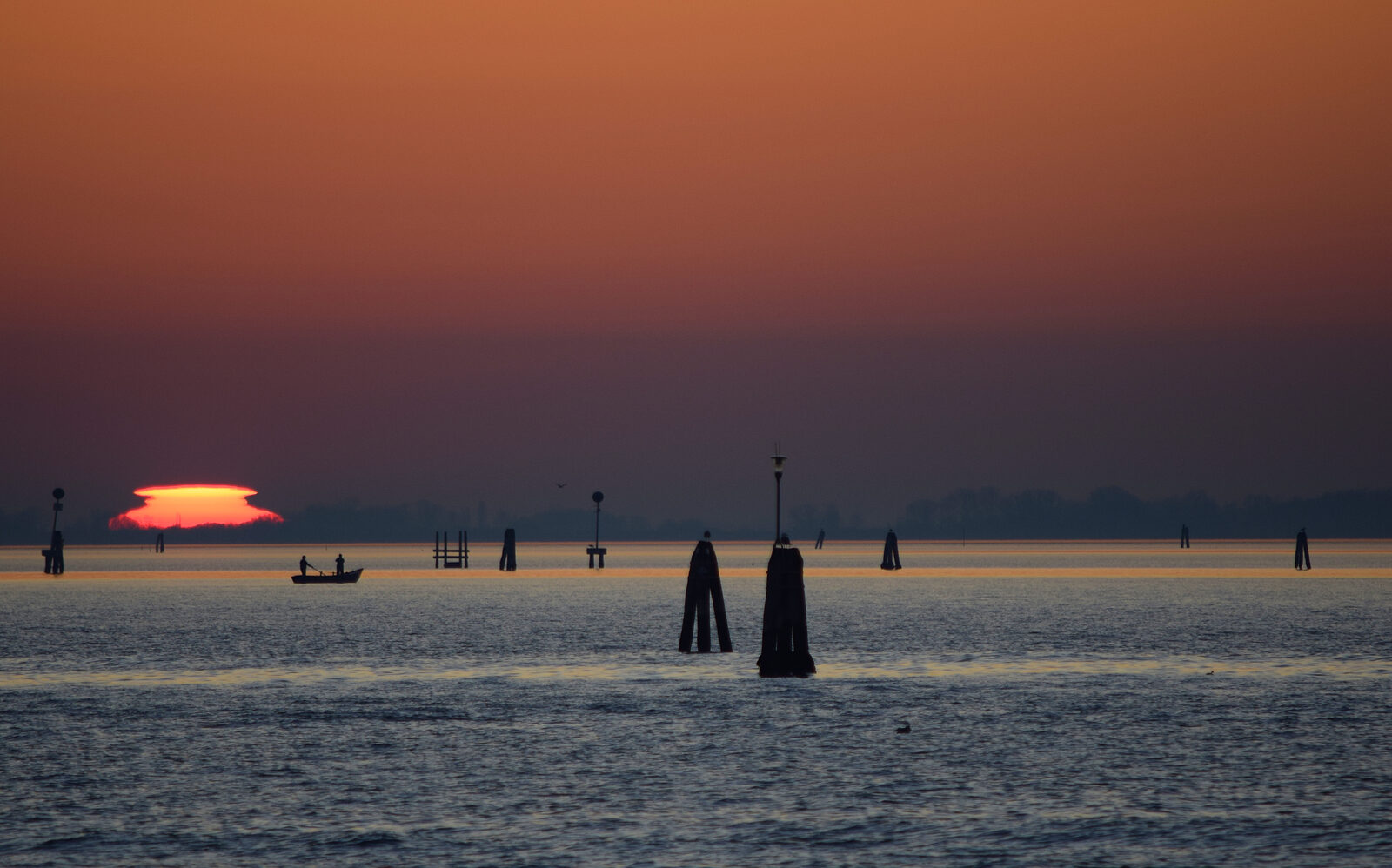 Biennale Gardens : The sun setting over the lagoon, marking the end of yet another day filled with cherished travel memories.