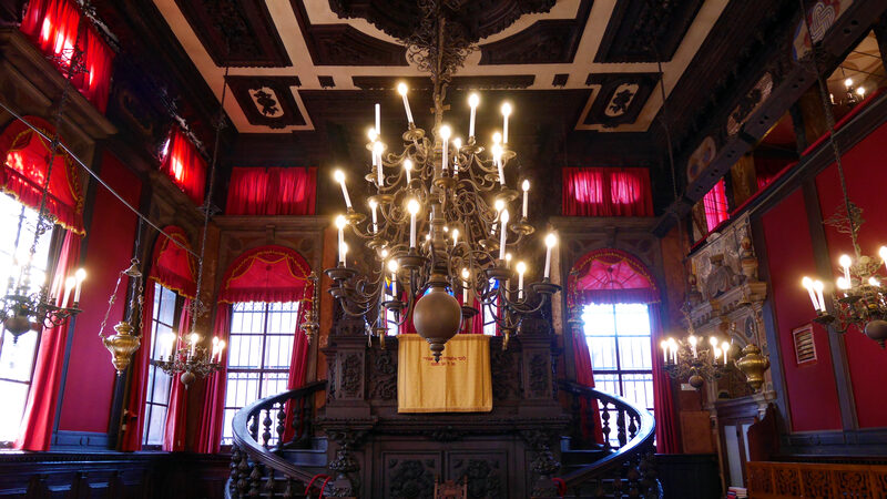 Jewish Ghetto : In contrast to the exterior, the interior is rich and refined, highlighted by the striking carved walnut bimah.