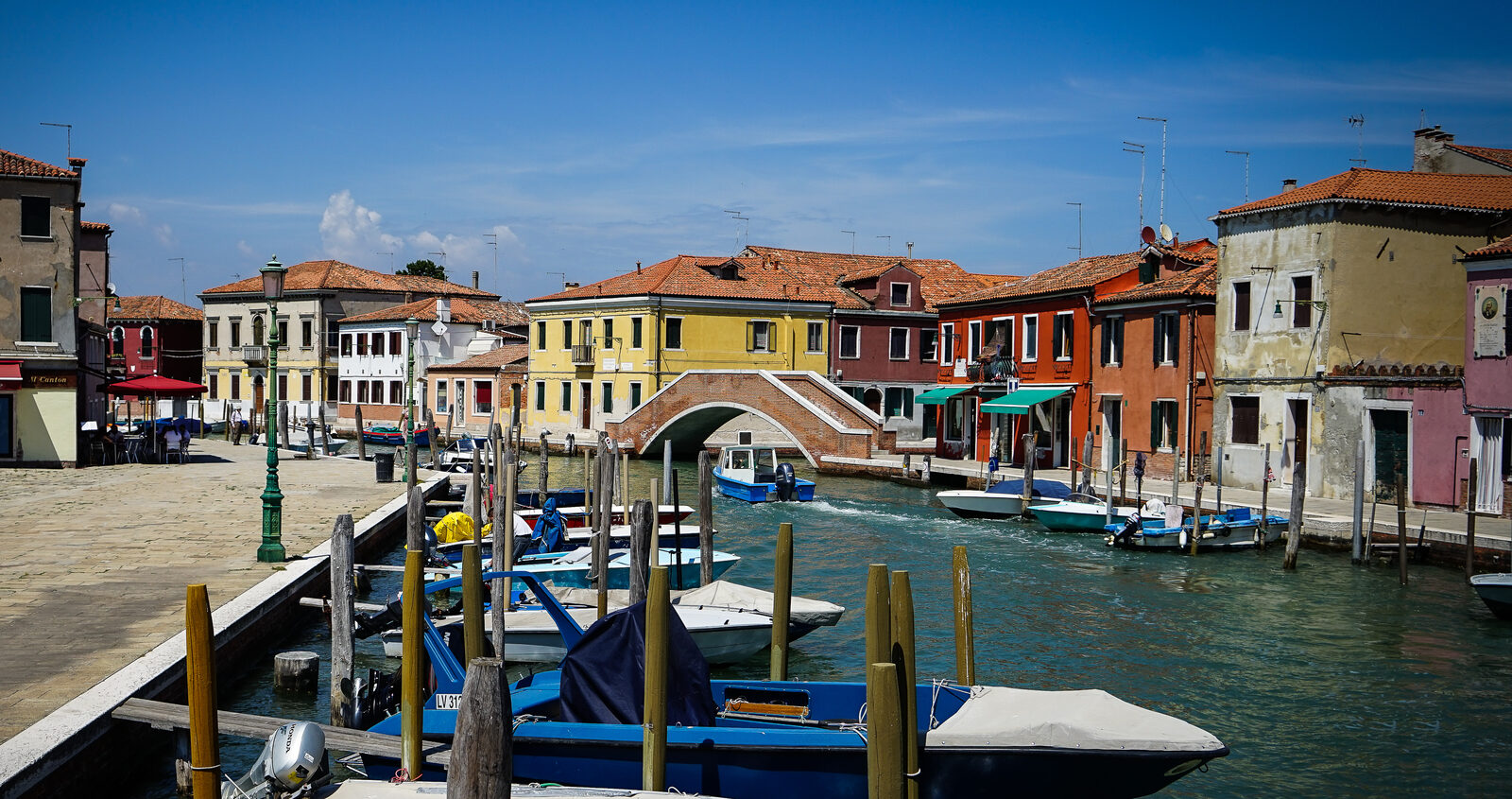 Murano : Strolling away from the bustling south and crossing Ponte Lungo, you'll find picturesque spots that mirror Burano's colorful charm.