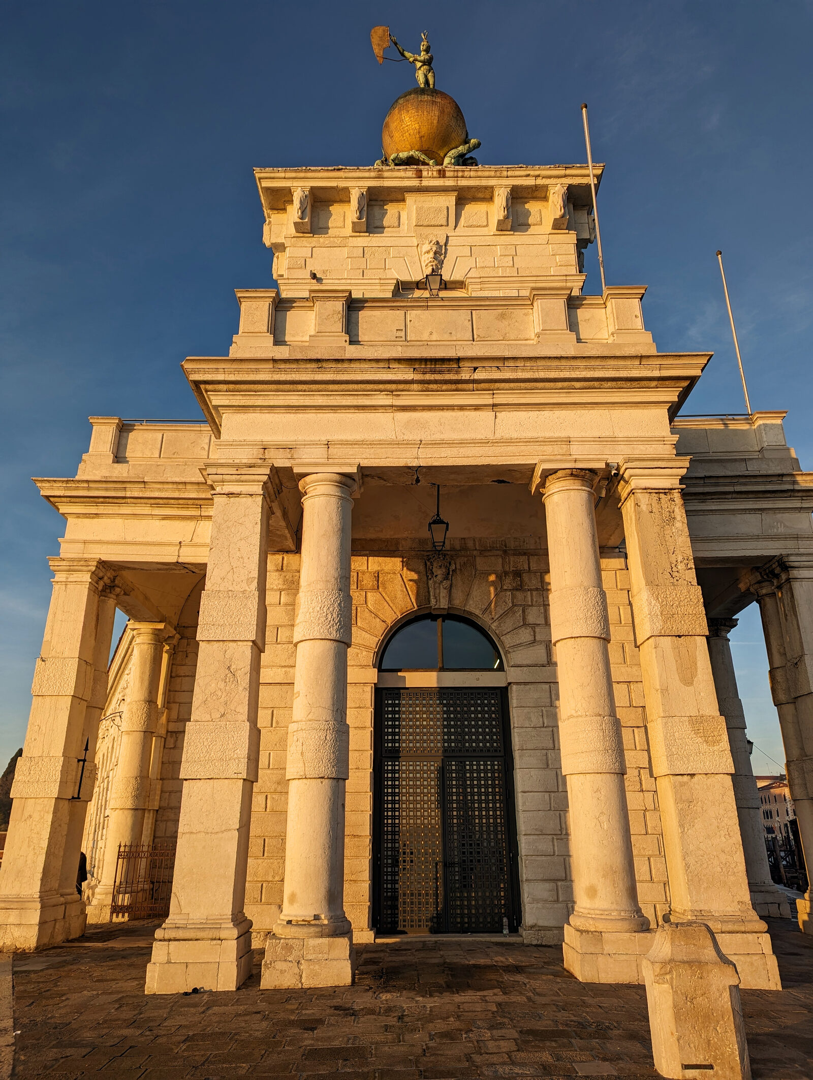 Punta della Dogana : Here’s the same gate and tower seen from outside, where you can spot the iconic weathervane perched atop.