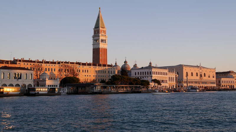Punta della Dogana : As the sun rises, its early rays bathe some of Venice's most iconic sights in a gentle pink glow.