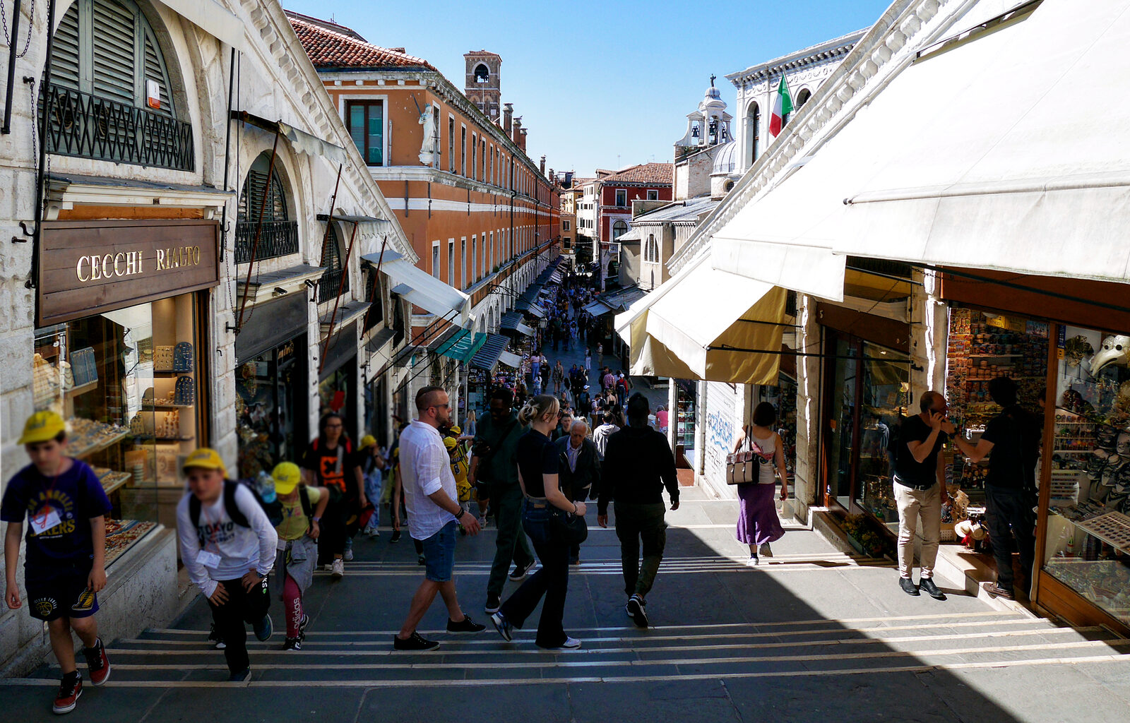 Rialto Bridge : Standing at the highest point of the bridge, on the central stairs that are lined with shops, looking west