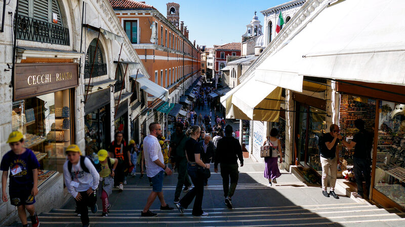 Rialto Bridge : Standing at the highest point of the bridge, on the central stairs that are lined with shops, looking west