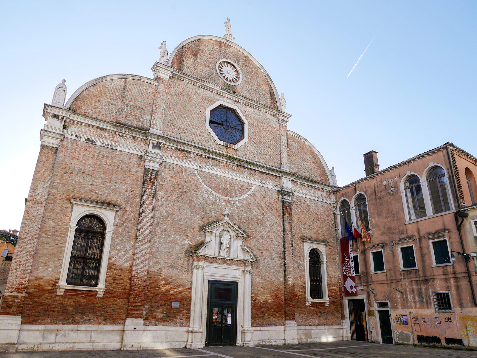 Santa Maria dei Carmini : Five statues adorn the early Venetian Renaissance brick facade: three saints on top and prophets Elijah and Elisha, considered to be the founders of the Carmelite order