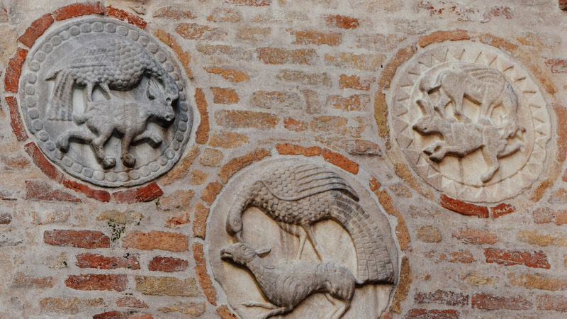Santa Maria dei Carmini : The five pateras on the top of the side entrance: medieval symbols of the struggle between good an evil