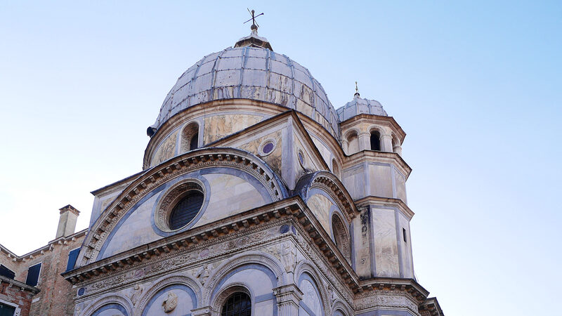 Santa Maria dei Miracoli : The rear facade, with the dome and the gracefully integrated small bell tower that rises 17 meters high
