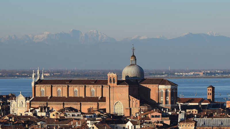 Santi Giovanni e Paolo : Seen from the bell tower of San Giorgio Maggiore, the basilica dominates the skyline, its vast dimensions unmistakable above the surrounding rooftops