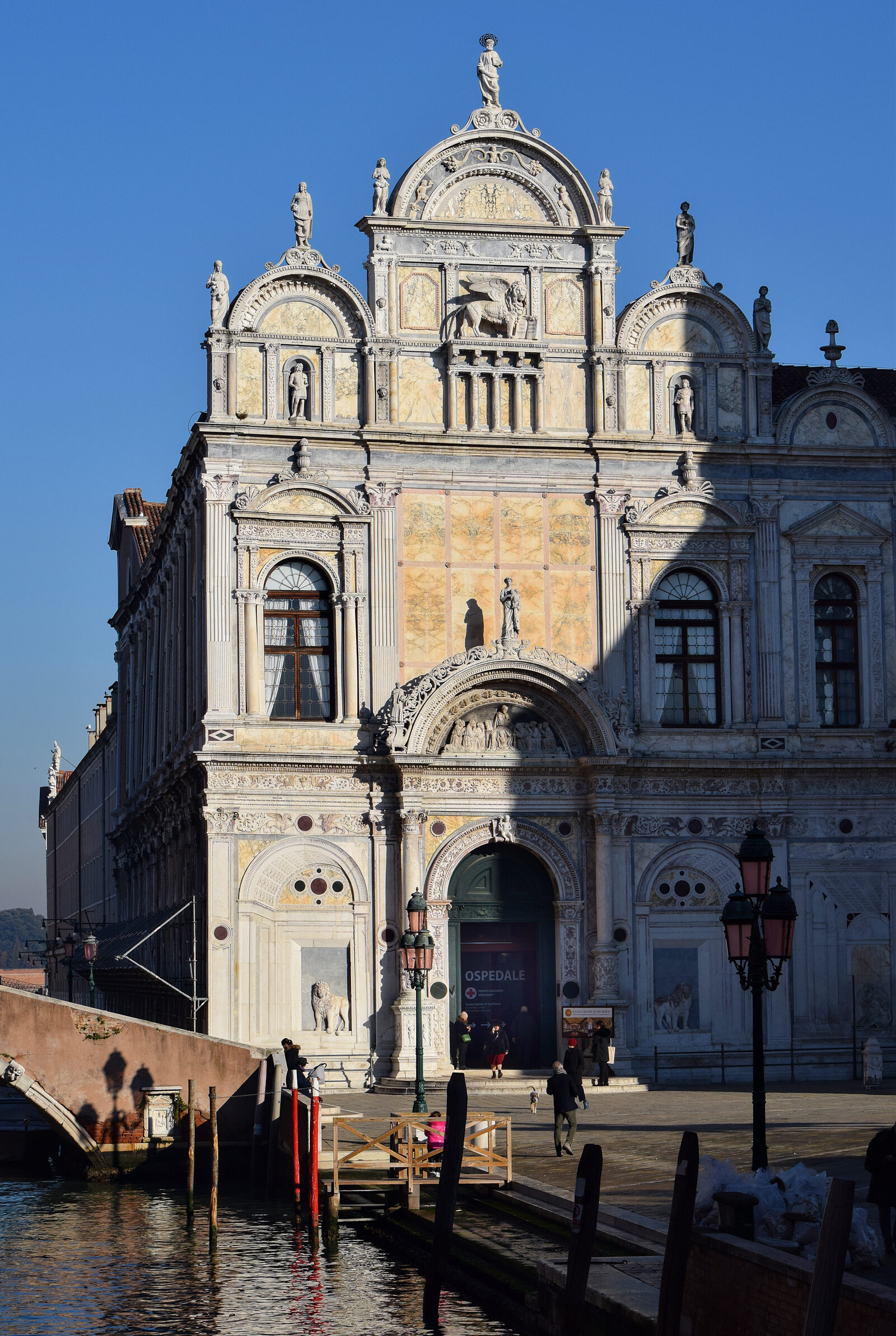 Scuola di San Marco : The facade features many marble statues of angels, warriors, and other fantastical creatures