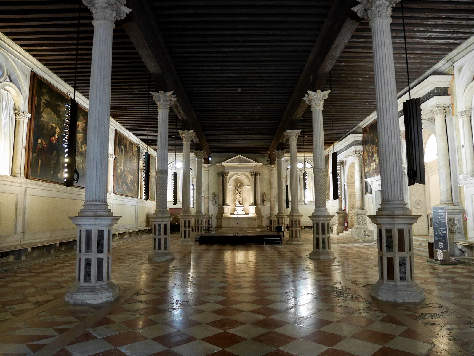 Scuola di San Rocco : The hall on the ground floor was used for liturgical services, as evidenced by the presence of the large altar with the monumental statue of Saint Roch