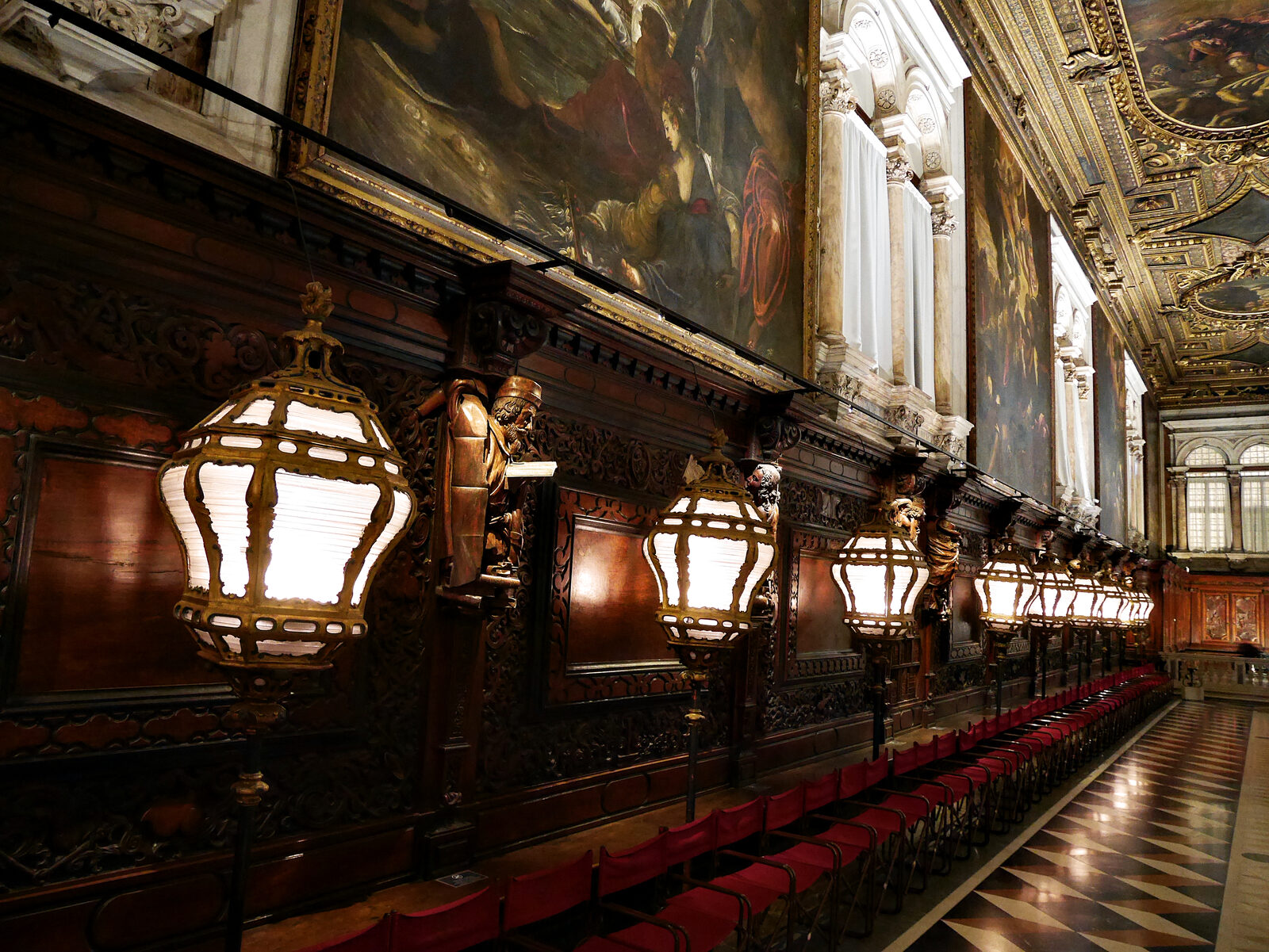 Scuola di San Rocco : The entire chapter hall is lined with walnut panels framed by unique allegorical sculptures crafted by Francesco Pianta