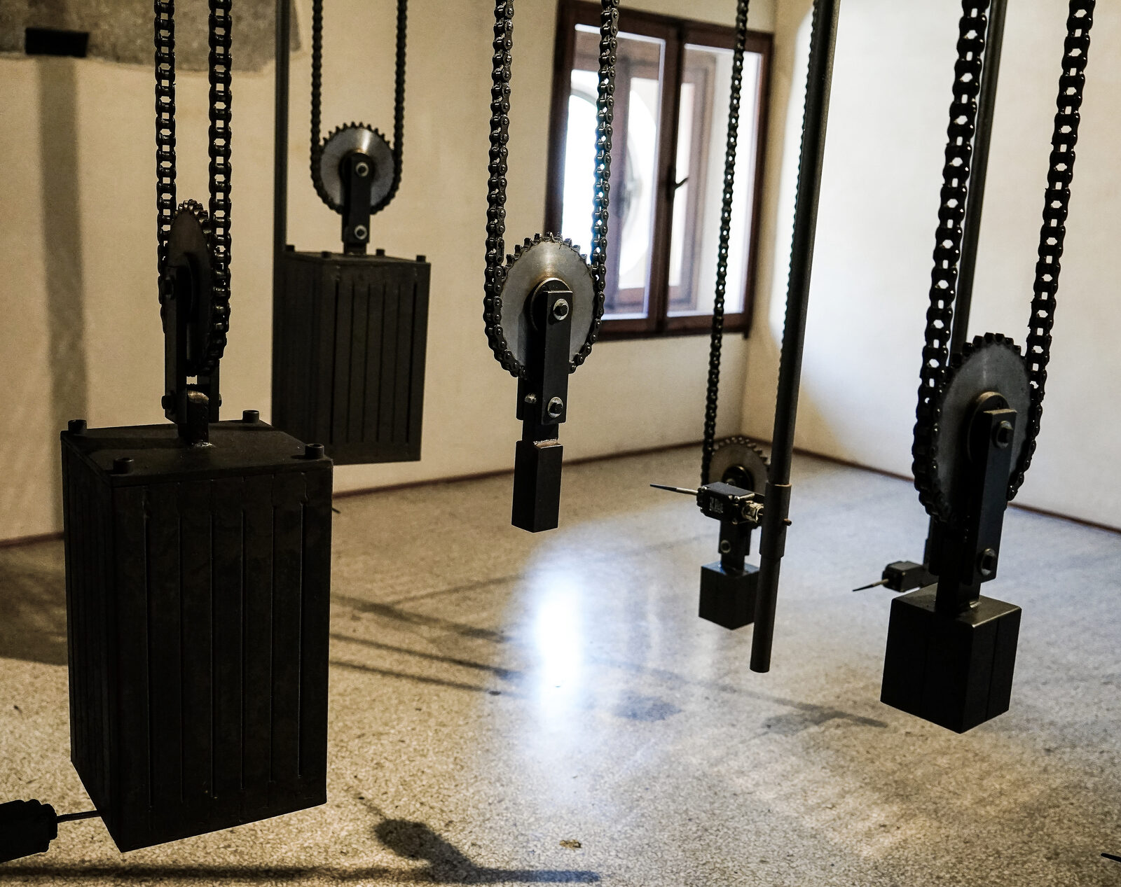 Clock Tower : The intricate system of pulleys and weights moves silently at regular intervals